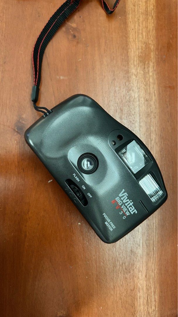 Vivitar Big View Film Camera (Category: Cameras) located in Makati City. Submitted by panyatiks (Listing ID 1407393185, Image 1). Description: Vivitar Big View BV30film camera RFS: this was included as a freebie but i already own too many cameras and it's really sad if this will not be used. - Built-in flash with on/off switch - Focus-free motor - Includes wrist strap - tested by the previous owner but i haven't tested it since i don't have any b