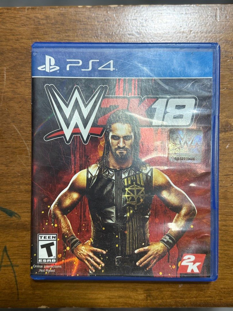 WWE 2K18 - PS4 Game (Category: PlayStation) located in Santa Rosa. Submitted by cheesecols (Listing ID 1407527737, Image 1). Description: WWE 2K18 for PlayStation 4. Features include MyCareer, Road to WrestleMania, and a Superstar roster. Includes a new graphics engine and commentary system. Offers a variety of game modes, including Create-a-Superstar and Universe mode. Features a soundtrack with artists like Kanye West and Bruno Mars. Like new ₱