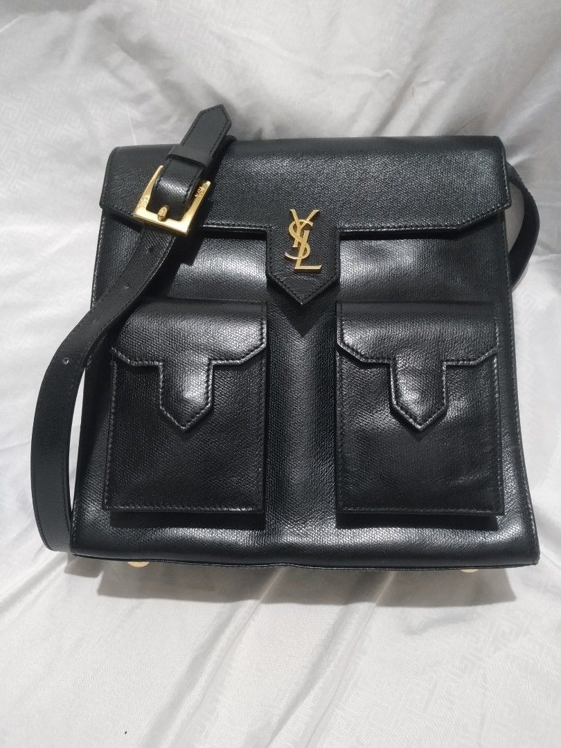 YSL Saint Laurent Shoulder Bag Black Leather (Category: Luxury Bags & Wallets) located in Pasig City. Submitted by aecollection03 (Listing ID 1407533927, Image 1). Description: - AUTHENTIC YSL Saint Laurent shoulder bag - Black leather - Two front pockets - Flap closure - Gold-tone logo and hardware(100%) - L9.5"×H9"×4" Strap drop 11-26" - Lined interior - Feet on the bottom -used once and stored..