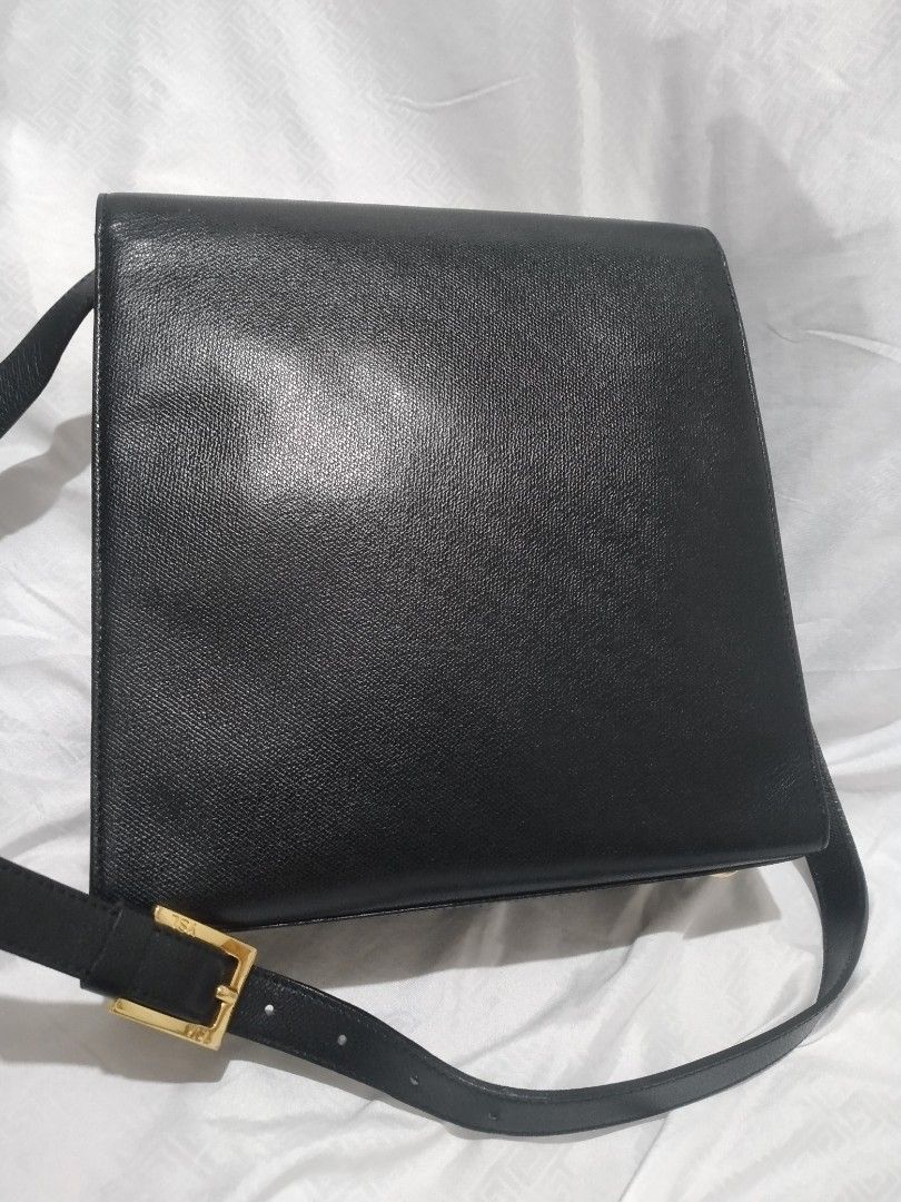 YSL Saint Laurent Shoulder Bag Black Leather (Category: Luxury Bags & Wallets) located in Pasig City. Submitted by aecollection03 (Listing ID 1407533927, Image 2). Description: - AUTHENTIC YSL Saint Laurent shoulder bag - Black leather - Two front pockets - Flap closure - Gold-tone logo and hardware(100%) - L9.5"×H9"×4" Strap drop 11-26" - Lined interior - Feet on the bottom -used once and stored..