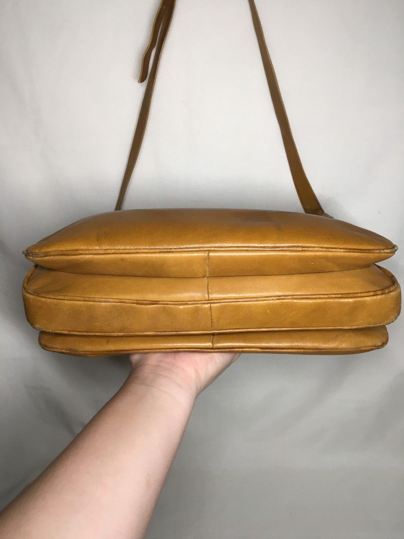 Zenith Vintage Leather Shoulder Bag (Category: Shoulder Bags) located in Baguio. Submitted by clothes.over.bros.ph_2020 (Listing ID 1407440998, Image 3). Description: - Vintage shoulder bag - Classic design - Long strap - Zip closure - Rich brown leather exterior - Black patterned interior lining - Spacious interior - Well-constructed - Suitable for everyday use.