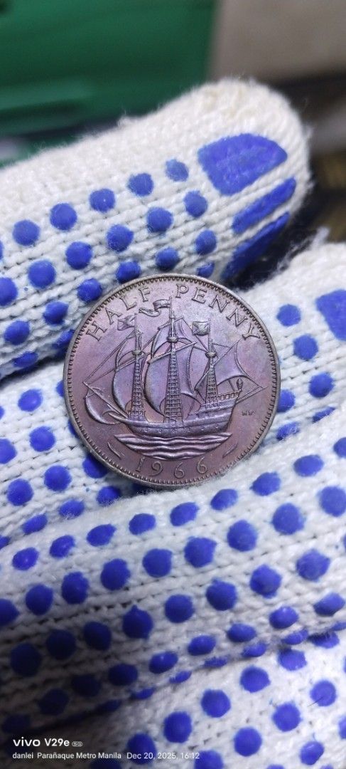 1956 Half Penny Coin (Category: Currency) located in Manila. Submitted by danlei_coin_collectible (Listing ID 1410894147, Image 2). Description: - 1956 Half Penny coin - Features Queen Elizabeth II - Features a ship - Ideal for coin collectors.