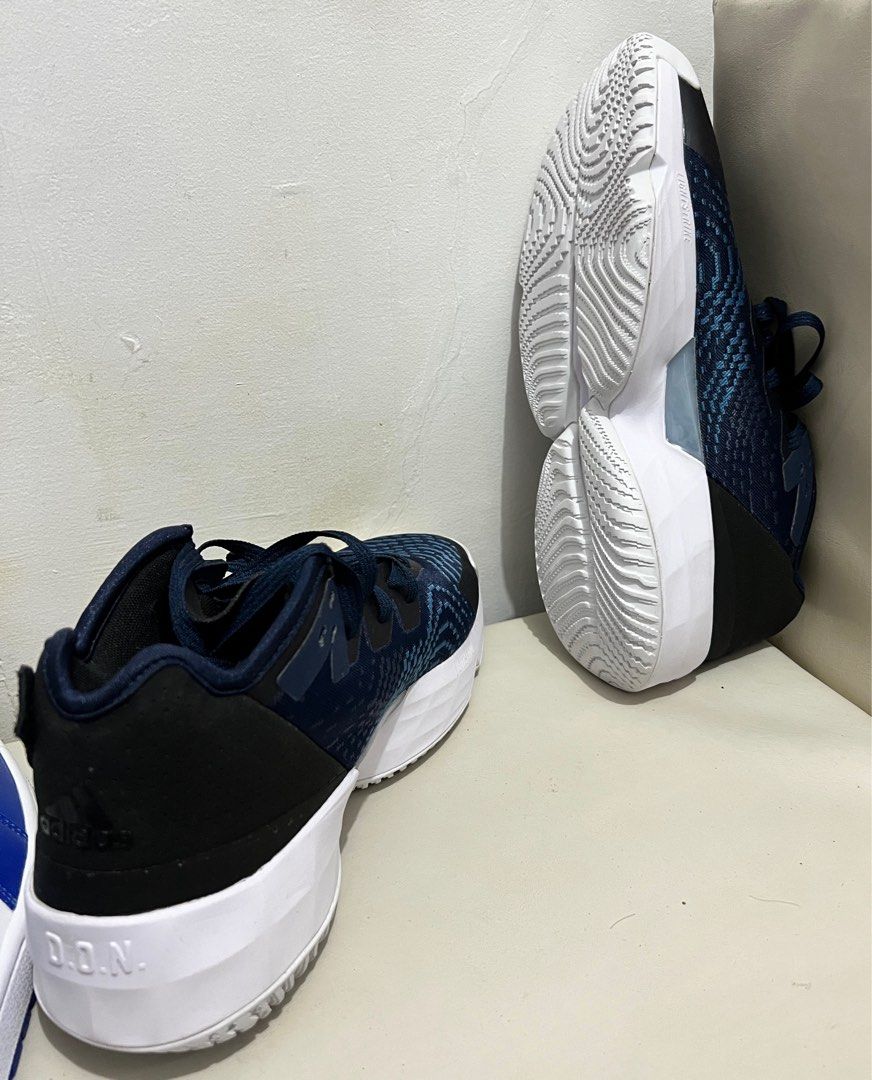 Adidas Donovan Mitchell (Category: Sneakers) located in Tiaong. Submitted by rmu57 (Listing ID 1410770149, Image 2). Description: - Adidas Donovan Mitchell basketball shoes - Color: Navy blue and white - Adidas logo on the side - D.O.N. branding on the heel - White midsole - Patterned outsole - Navy blue laces.