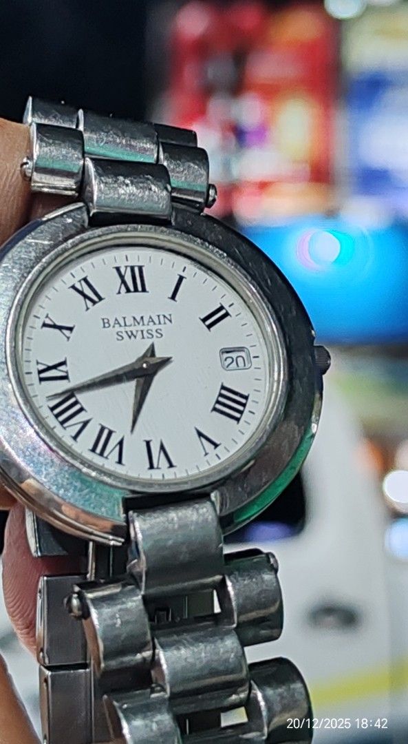 Balmain Swiss (Category: Luxury Watches) located in San Jose del Monte. Submitted by watchdoctorservicecenter (Listing ID 1410825292, Image 2). Description: The watch in the image is a Balmain Swiss wristwatch with a white dial, Roman numerals, a date window, and a stainless steel bracelet. The visual search results closely match models described as vintage or classic from the brand. Key Features: Brand: Balmain Origin: Swiss Made Material: Stain