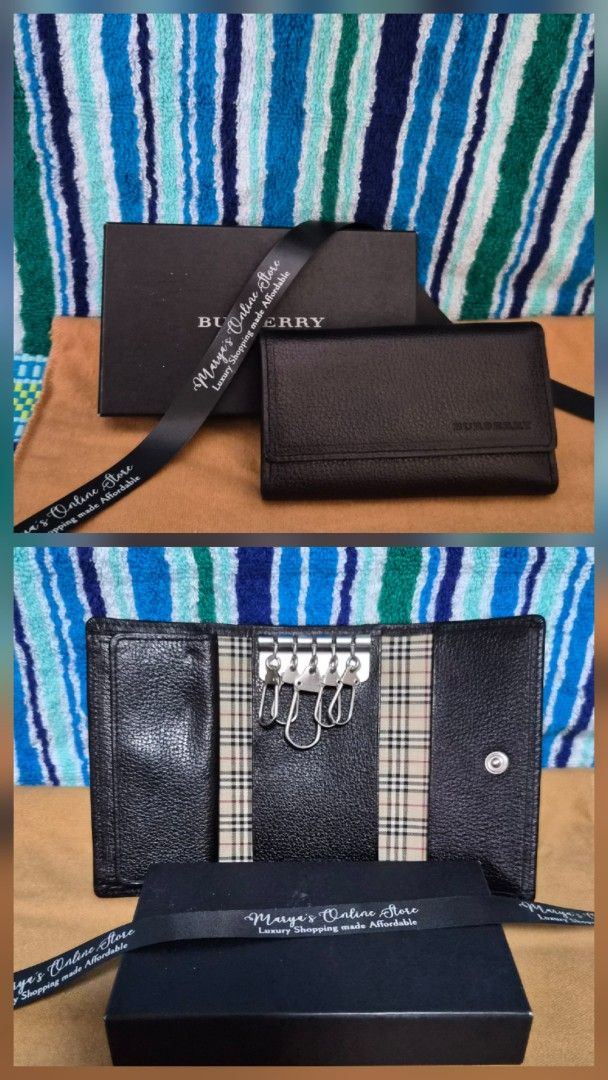 Burberry Key Holder (Category: Luxury Bags & Wallets) located in Quezon City. Submitted by marya_s (Listing ID 1410766406, Image 1). Description: - Authentic Burberry key holder - Classic check pattern design - Multiple key rings - Secure snap closure - Comes with original box and ribbon - Exterior: Black leather - Interior: Iconic Burberry check.