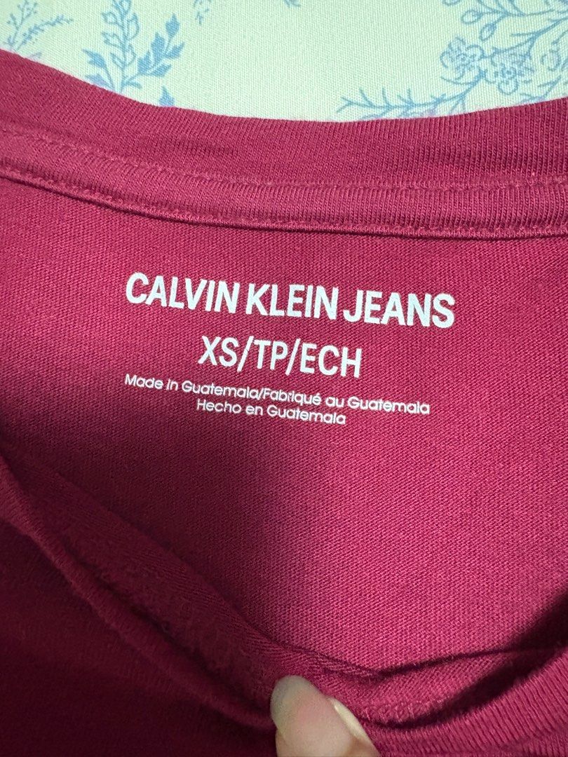 Calvin Klein Jeans Maroon Shirt (Category: Shirts) located in Quezon City. Submitted by wardrobelele (Listing ID 1410875357, Image 2). Description: - xs on tag but fits S - worn once or twice - no flaws.