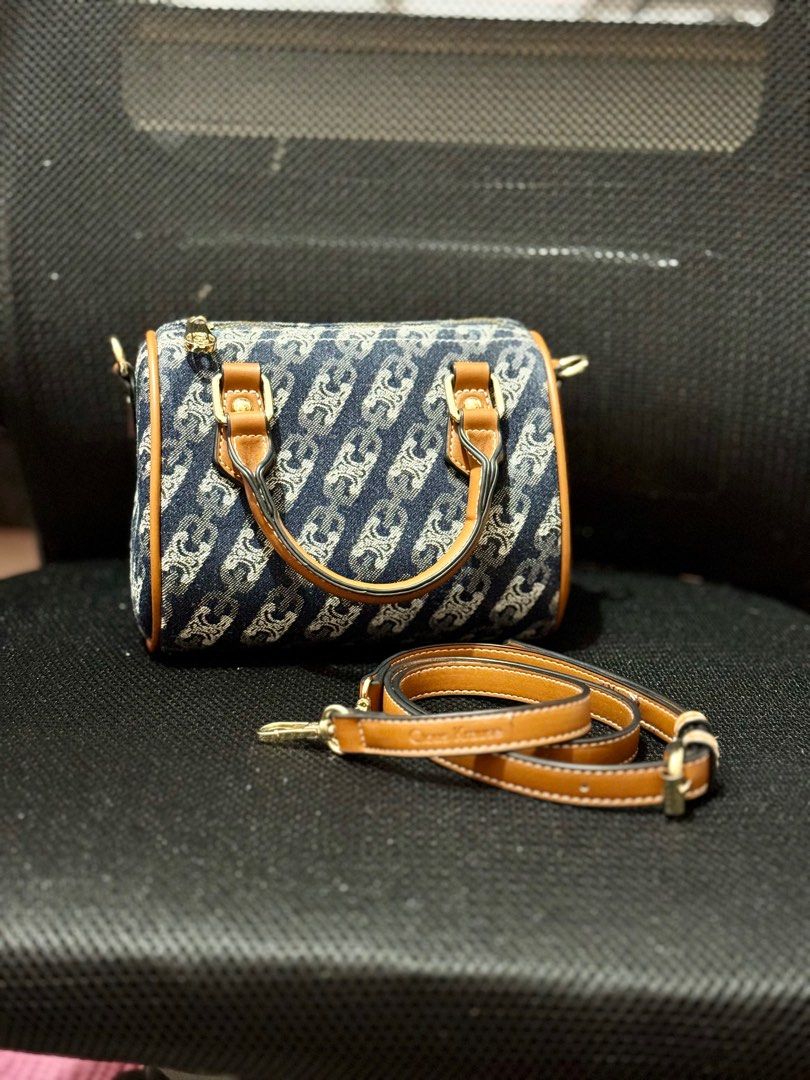 Celine-style Denim Handbag with Shoulder Strap (Category: Luxury Bags & Wallets) located in Tanza. Submitted by mypreloved-64cc0b (Listing ID 1410811991, Image 1). Description: - Denim handbag by Cious Krause - Chain-like design - Detachable brown shoulder strap - Brown leather accents - Gold-colored hardware - Top handle - Rectangular shape.