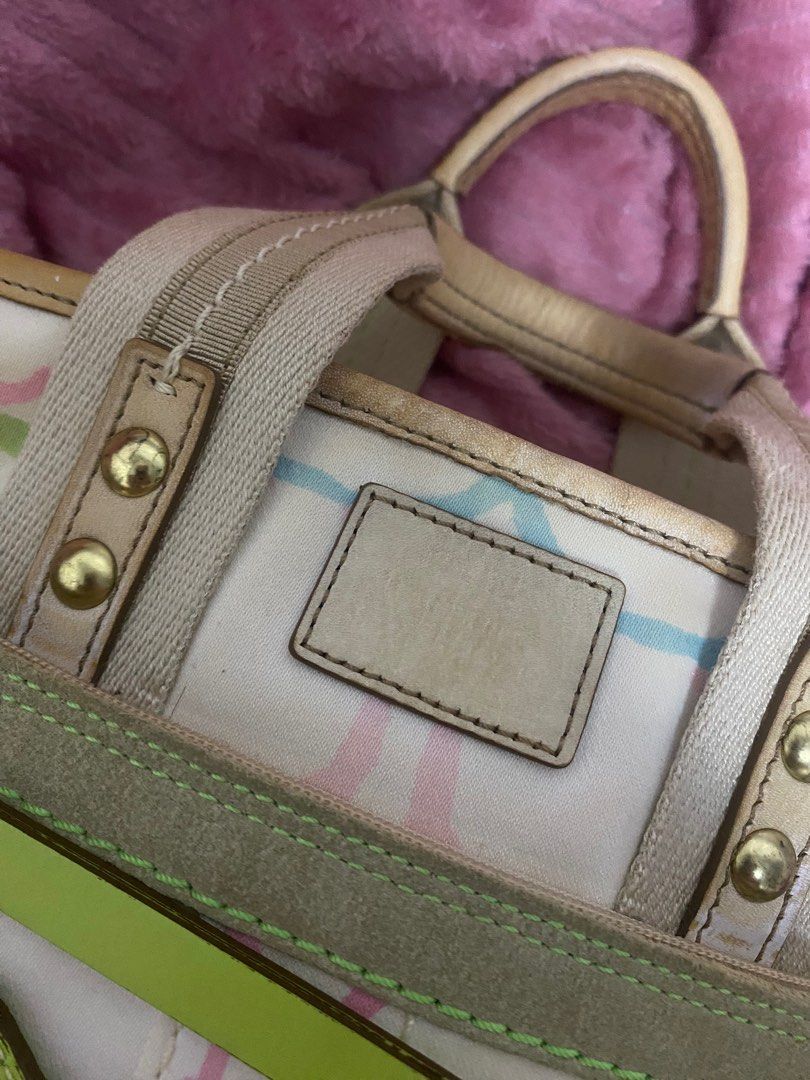 Coach Multicolor Handbag (Category: Luxury Bags & Wallets) located in Santiago. Submitted by jmayaa (Listing ID 1410824845, Image 3). Description: - Coach handbag with a colorful design - Zip closure - Dual top handles - Detachable tag - Interior small pocket - Made in China - Minor wear on handles and base.