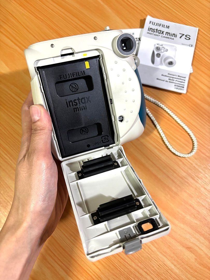 Fujifilm Instax Mini 7S Camera (Mint Condition) (Category: Cameras) located in Valenzuela. Submitted by caulfieldscollection (Listing ID 1410659891, Image 3). Description: Good as new! Used only a few times. Selling my Fujifilm Instax Mini 7S because I rarely use it and want to clear out some space. Condition: 100% Working. No internal or external issues. Exterior: No major scratches, fading, or dents. Battery Compartment: Clean, no corrosion Sto