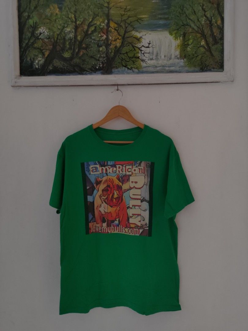 Green American Bully T-shirt (Category: Tshirts & Polo Shirts ) located in Cebu City. Submitted by watixx (Listing ID 1410807440, Image 1). Description: - Size L 21x28 - Green crew neck t-shirt - Features an American Bully graphic print - Print includes "American Bully" and "lovemybulls.com" - Made of a cotton blend.