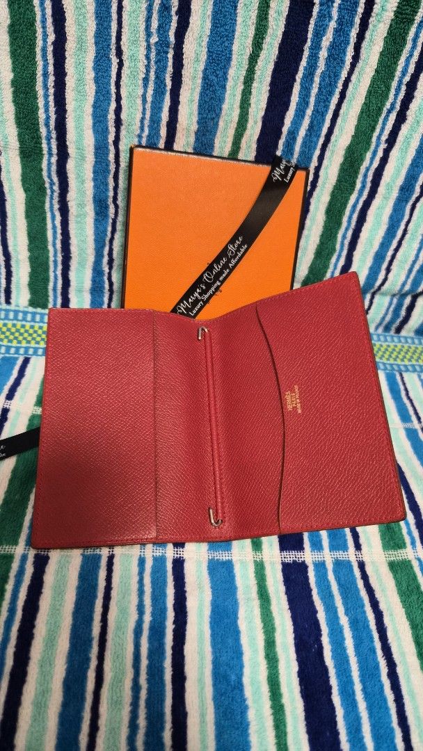 Hermes Red Leather Passport Holder (Category: Luxury Bags & Wallets) located in Quezon City. Submitted by marya_s (Listing ID 1410768248, Image 1). Description: - Authentic Hermes - Includes the original Hermes box - Elegant Hermes logo visible on the interior. - Crafted from high-quality leather..