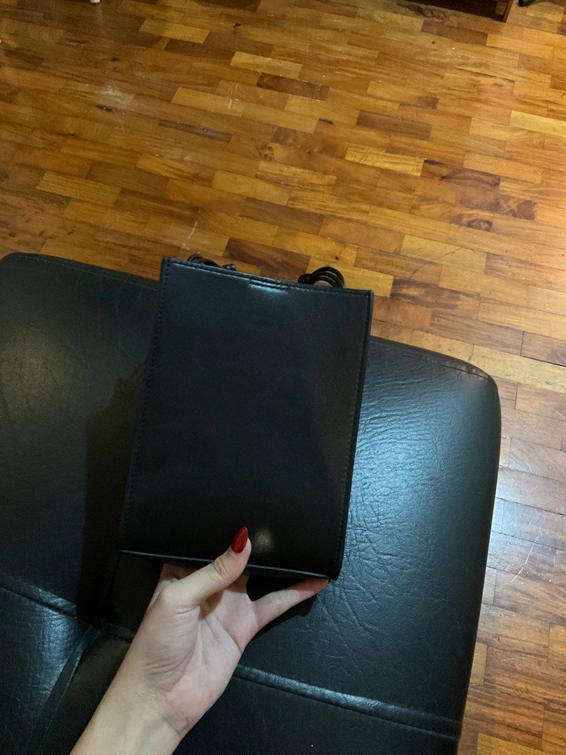 Jil Sander Black Leather Crossbody Bag (Category: Cross-body Bags) located in Paranaque City. Submitted by nadzdeclutters (Listing ID 1410840804, Image 2). Description: Can’t guarantee authenticity hence the price, but the bag itself is of great quality :-) DM me for more pictures! Auth is 30k+ 😆 RFS: Decluttering + not my style :( .