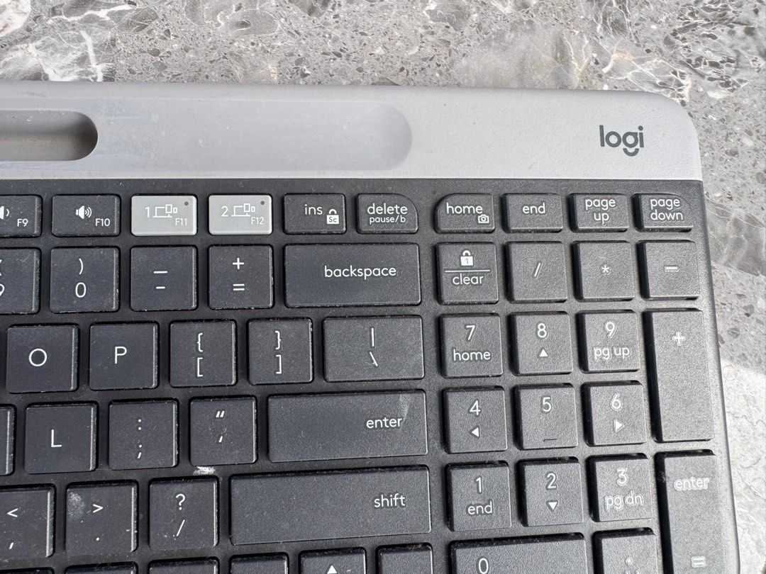 [Back to school] Logi Keyboard (Category: Computer Keyboard) located in Bacoor. Submitted by marnievera (Listing ID 1410792157, Image 3). Description: - Logi keyboard with a stylish dark grey and light grey color scheme. - Full-sized keyboard including a number pad. - Integrated stand for comfortable typing. - Black keys with clear white lettering..