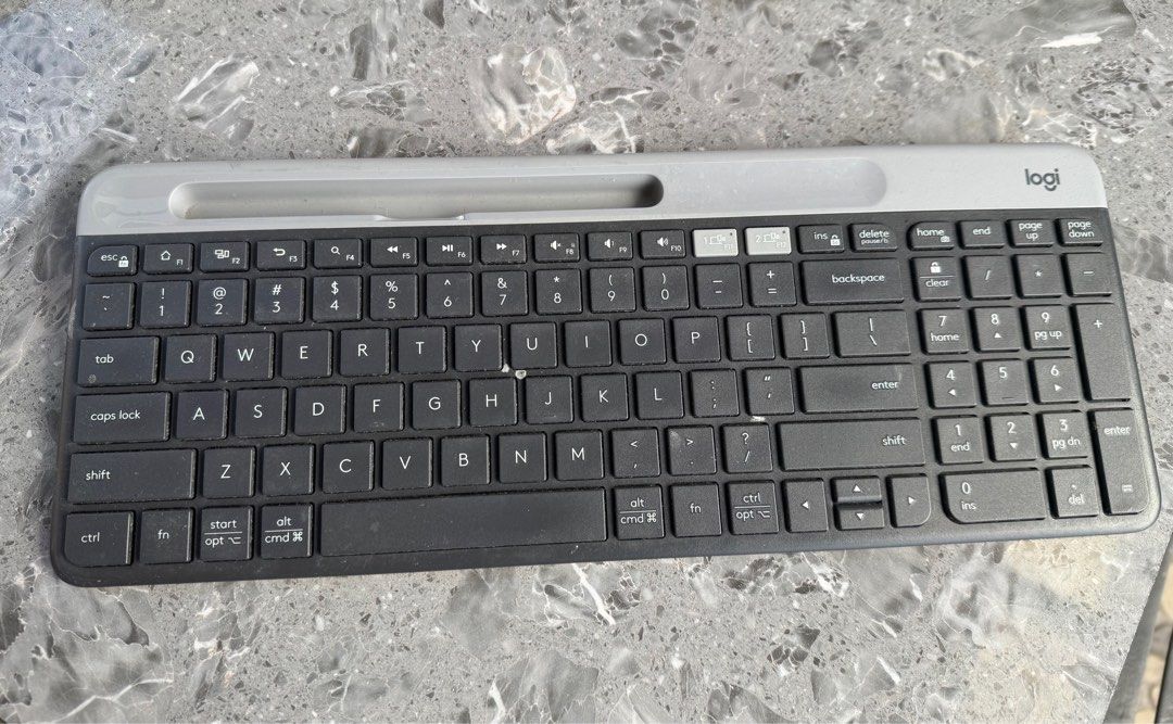 [Back to school] Logi Keyboard (Category: Computer Keyboard) located in Bacoor. Submitted by marnievera (Listing ID 1410792157, Image 2). Description: - Logi keyboard with a stylish dark grey and light grey color scheme. - Full-sized keyboard including a number pad. - Integrated stand for comfortable typing. - Black keys with clear white lettering..