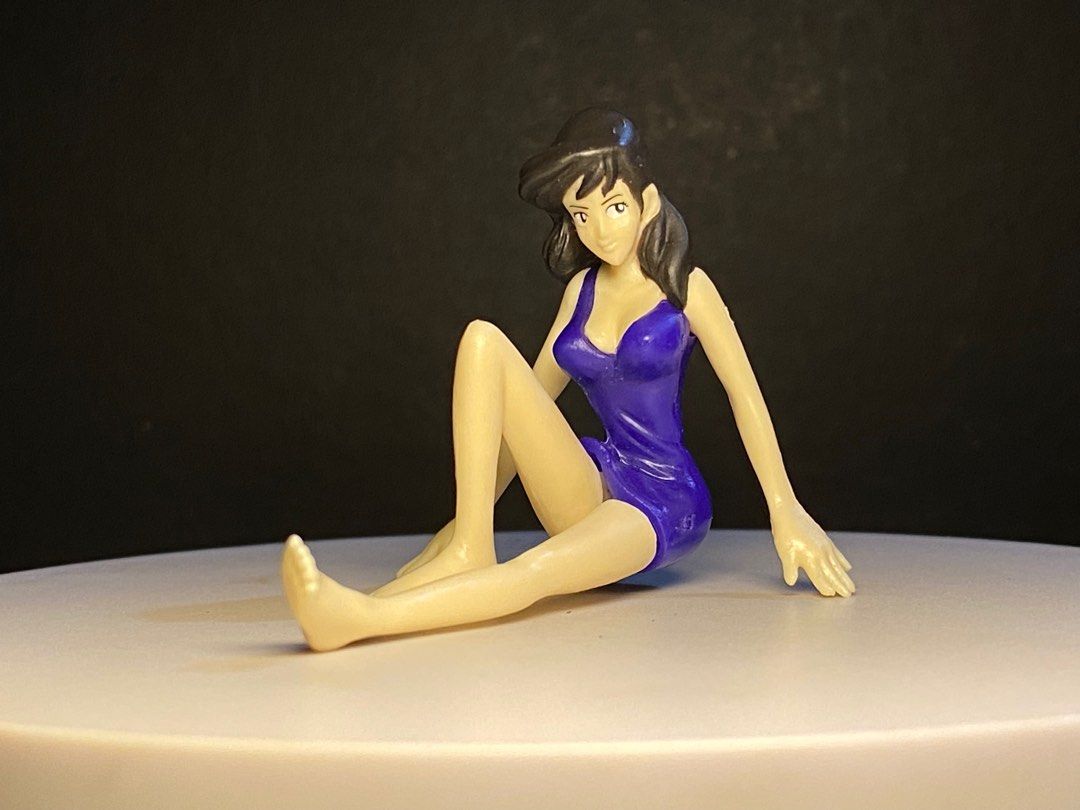 Lupin the Third Fujiko Mine Figure (Category: Figurines & Statues) located in Agoo. Submitted by collect12 (Listing ID 1410831842, Image 1). Description: - Fujiko Mine figure - From Lupin the Third - Features a blue swimsuit - Seated pose - Made of plastic - Small size (see scale) - Collectible item - Perfect for fans!.