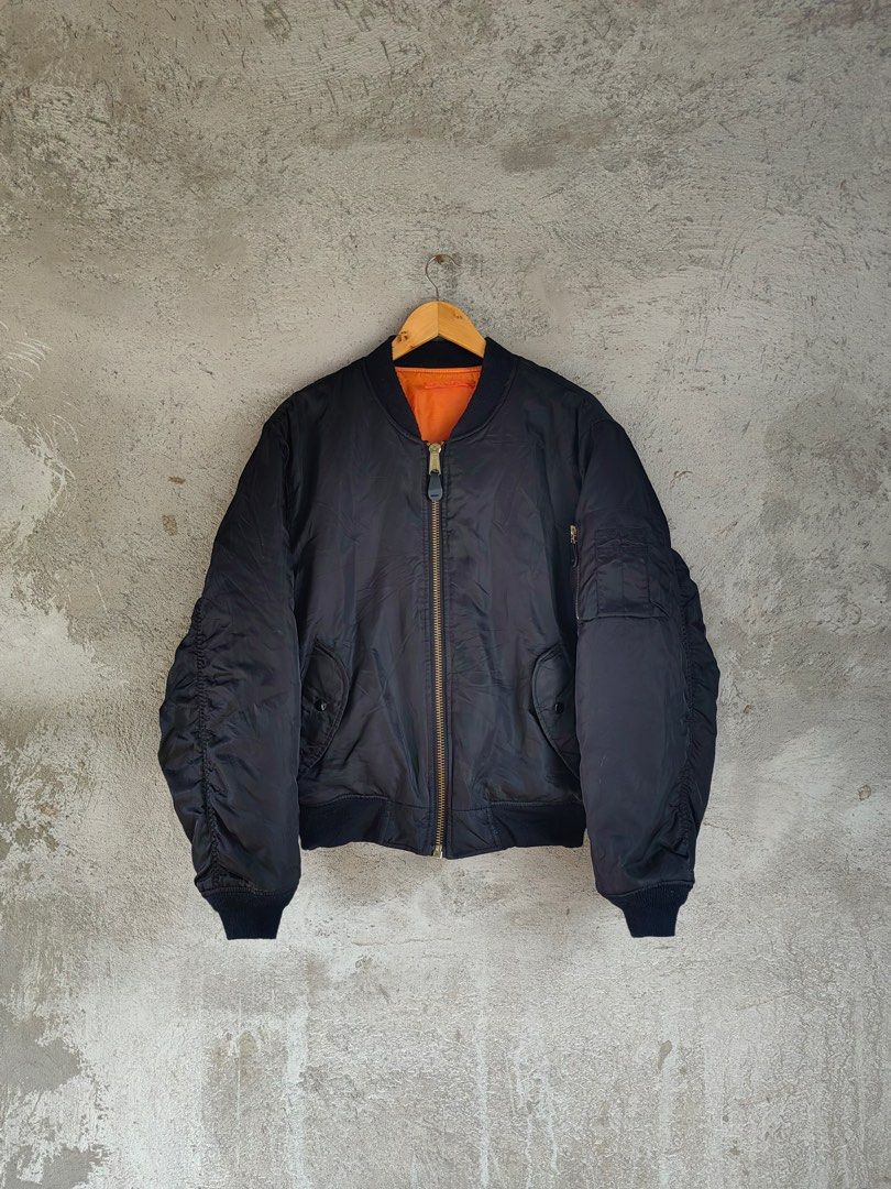 MA-1 Bomber Jacket (Category: Activewear) located in Trece Martires City. Submitted by kenzolois2004 (Listing ID 1410800365, Image 1). Description: Black MA-1 bomber jacket by Chic Elegant by Payvand. Features a reversible orange lining and a zip closure. The jacket has a size S label. Made in Korea. The jacket has a classic bomber silhouette with ribbed cuffs and hem. The jacket has a MAI zipper. Small on tag (large frame).