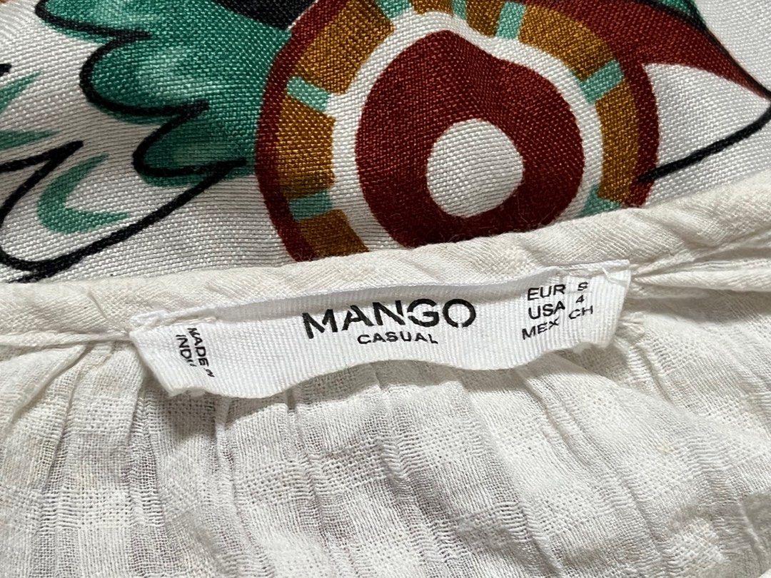 Mango Casual White Embroidered Blouse (Category: Blouses) located in Paranaque City. Submitted by rieclutter (Listing ID 1410781586, Image 3). Description: - Mango white blouse - Embroidered details - Long sleeves - boatneck neckline - Textured fabric - Button details - Size: EUR S, USA 4, MEX CH.