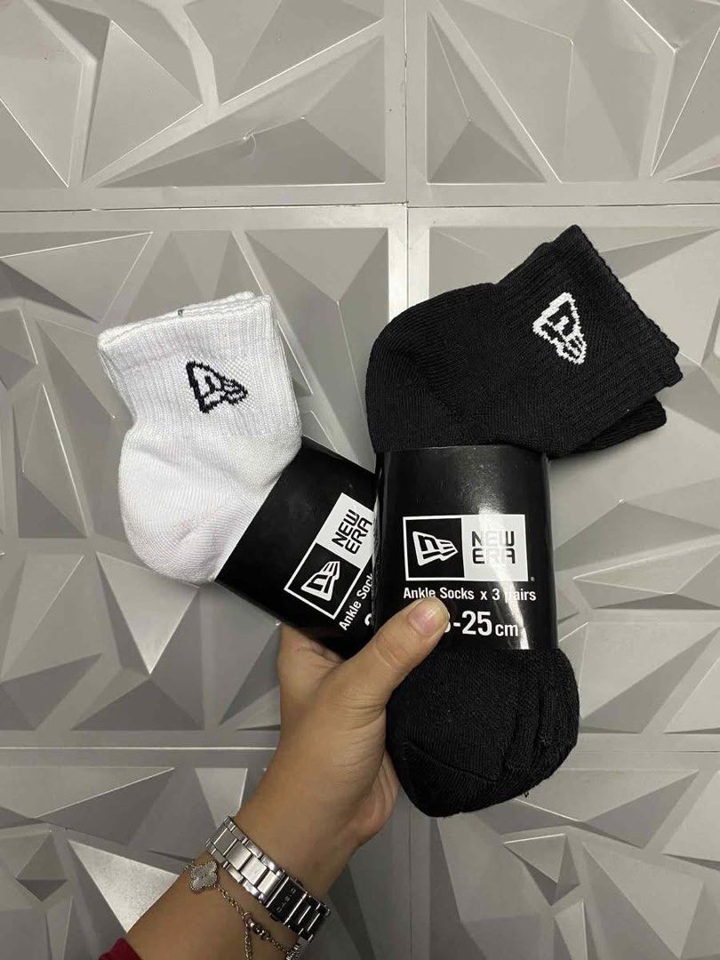 New Era Ankle Socks (3 pairs) (Category: Socks) located in Taguig. Submitted by julzfausti03386 (Listing ID 1410720673, Image 3). Description: New Era ankle socks, sold in packs of three pairs. Available in black and white. Sizes available are 23-25cm, 25-27cm, and 27-29cm. Each pair features the New Era logo. Perfect for everyday wear..