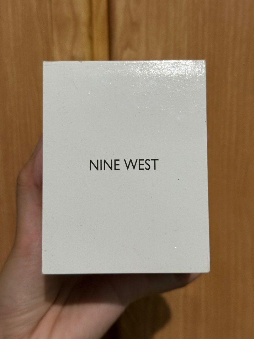 Original Nine West Watch (Category: Women's Watches) located in Quezon City. Submitted by junieveeee (Listing ID 1410775113, Image 3). Description: Selling for ₱2,000 negotiable 💗💗 complete with box and warranty card - Nine West watch - Square face design - Two-tone gold and silver band - White dial with gold-tone hands and markers - Comes with original box - Features a clasp closure - Perfect for everyday wear Loc near fishermall quezon avenue