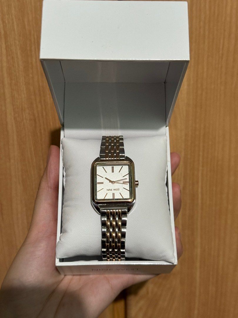 Original Nine West Watch (Category: Women's Watches) located in Quezon City. Submitted by junieveeee (Listing ID 1410775113, Image 1). Description: Selling for ₱2,000 negotiable 💗💗 complete with box and warranty card - Nine West watch - Square face design - Two-tone gold and silver band - White dial with gold-tone hands and markers - Comes with original box - Features a clasp closure - Perfect for everyday wear Loc near fishermall quezon avenue