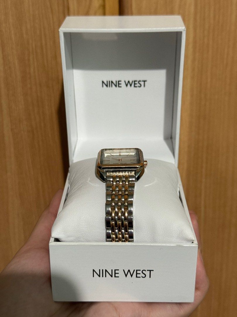 Original Nine West Watch (Category: Women's Watches) located in Quezon City. Submitted by junieveeee (Listing ID 1410775113, Image 2). Description: Selling for ₱2,000 negotiable 💗💗 complete with box and warranty card - Nine West watch - Square face design - Two-tone gold and silver band - White dial with gold-tone hands and markers - Comes with original box - Features a clasp closure - Perfect for everyday wear Loc near fishermall quezon avenue