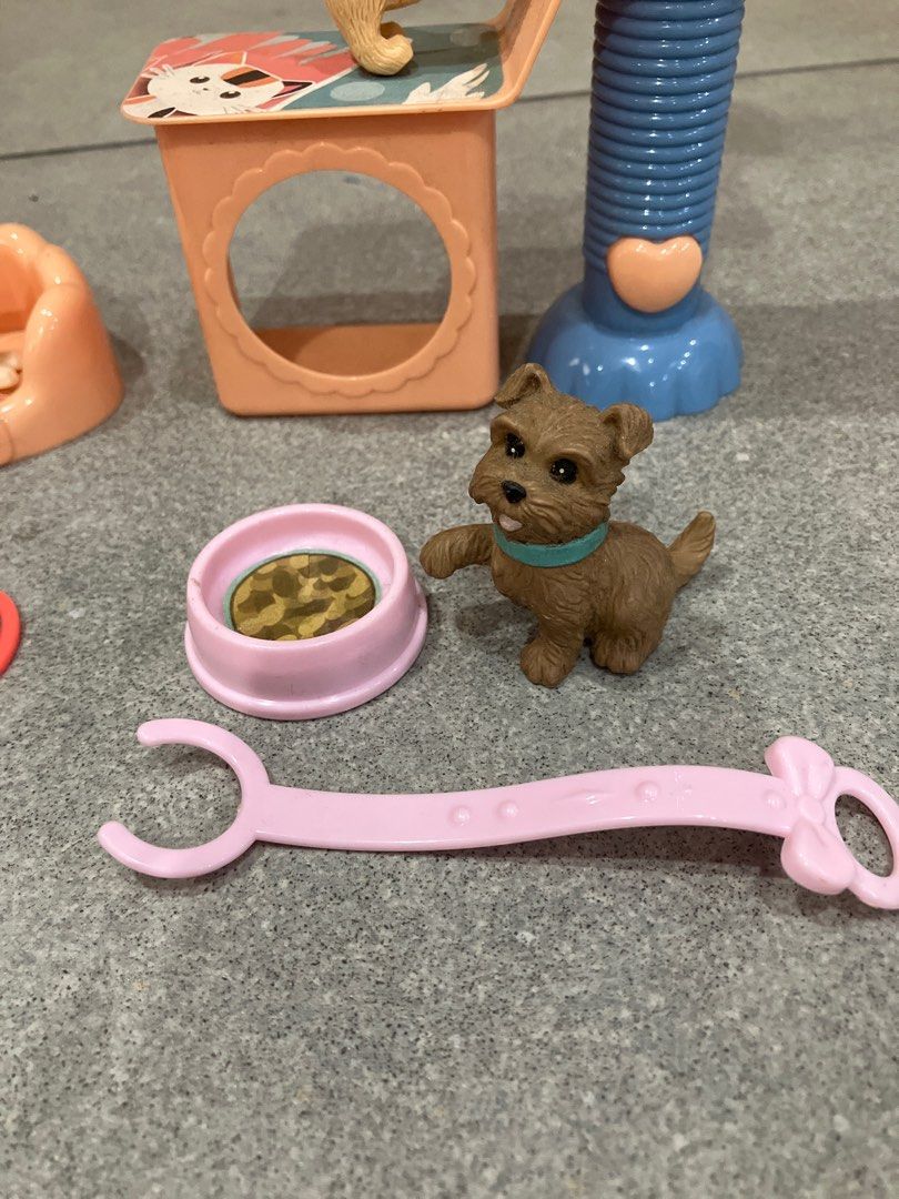 Pet Shop Toy Set (Category: Kids Toys) located in San Juan City. Submitted by stillgoodsecondhand (Listing ID 1410796419, Image 2). Description: - Complete pet shop toy set - Includes a cat tree, dog, and several cats - Features a bed and food bowl - Comes with grooming tools and other accessories - adding a dog with an outfit and dog bowl from another set - Perfect for imaginative play - Ideal for kids who love pets.