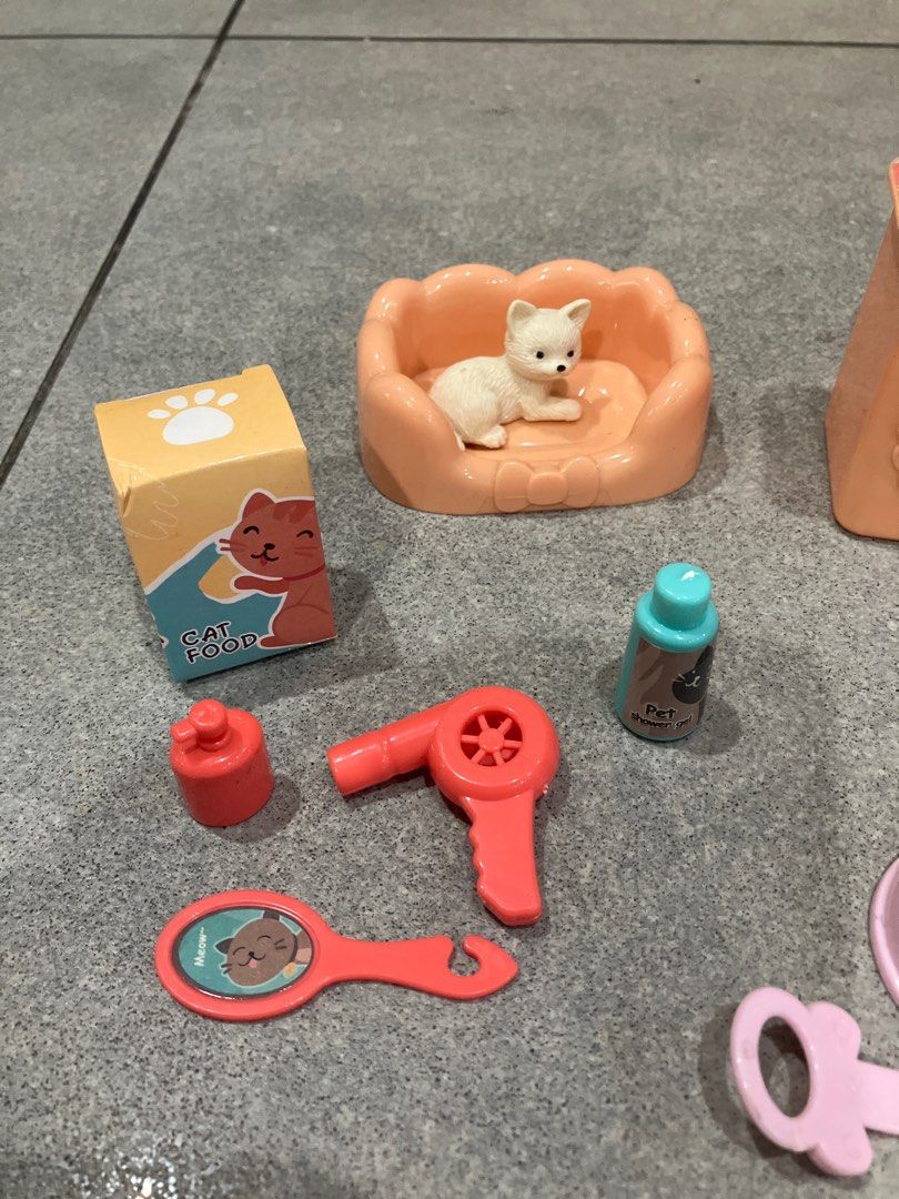 Pet Shop Toy Set (Category: Kids Toys) located in San Juan City. Submitted by stillgoodsecondhand (Listing ID 1410796419, Image 3). Description: - Complete pet shop toy set - Includes a cat tree, dog, and several cats - Features a bed and food bowl - Comes with grooming tools and other accessories - adding a dog with an outfit and dog bowl from another set - Perfect for imaginative play - Ideal for kids who love pets.