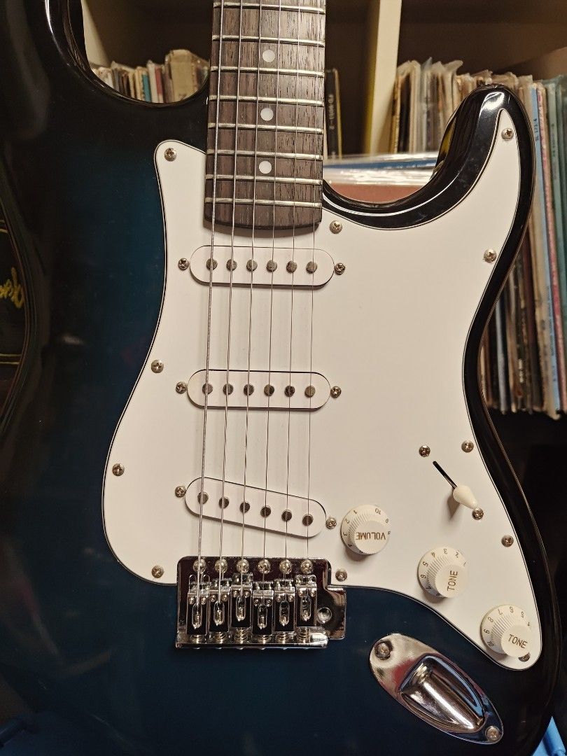 Photogenic Electric Guitar with Amplifier (Category: Musical Instruments) located in Quezon City. Submitted by jhayjaz08 (Listing ID 1410722285, Image 2). Description: Rush!! - Photogenic electric guitar stratocaster - Blue and white finish - White pickguard - Three pickups - Includes Photogenic PG-10 guitar amplifier - Fender guitar strap included Very good condition 6k set.