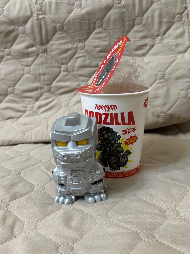 RokiMoto Godzilla Collectible Figure (Category: Figurines & Statues) located in Manila. Submitted by jongabor (Listing ID 1410865174, Image 2). Description: - RokiMoto Godzilla figure - Includes two figures: - Godzilla figure holding a bowl of noodles. - Mechagodzilla figure. - Both figures come with their original RokiMoto Godzilla cup packaging. - 770 each - Manila - Delivery c/o buyer - MOP: Gcash - RFS: Dupes.