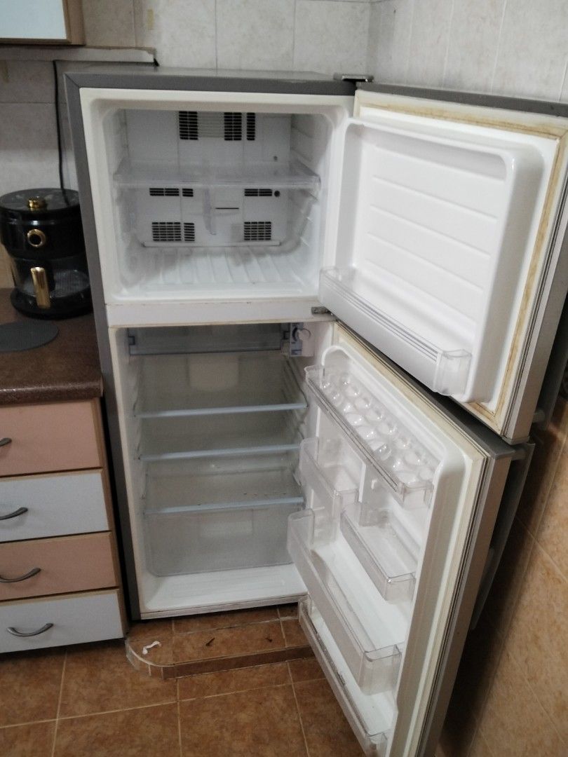 Sharp Fridge (Category: Refrigerators & Freezers) located in Singapore. Submitted by 16g00dstuff (Listing ID 1410729049, Image 2). Description: Well-used fridge, working well. Inside already cleaned. Buyer need to arrange own transport. specification is at picture 5th & 6th.