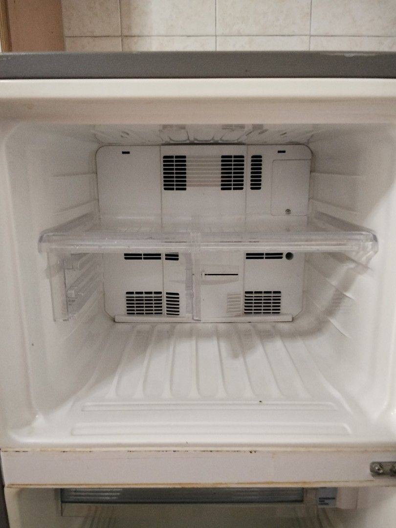Sharp Fridge (Category: Refrigerators & Freezers) located in Singapore. Submitted by 16g00dstuff (Listing ID 1410729049, Image 3). Description: Well-used fridge, working well. Inside already cleaned. Buyer need to arrange own transport. specification is at picture 5th & 6th.