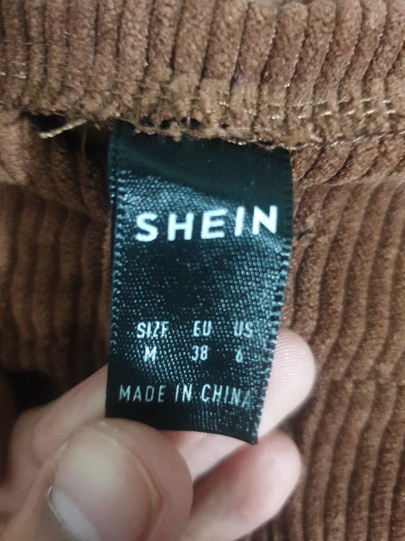 SHEIN Corduroy Pants - Size M (Category: Jeans) located in Manila. Submitted by sansairo (Listing ID 1410741245, Image 3). Description: - SHEIN corduroy pants - Size: M - Features a button closure - Classic design - Comfortable corduroy fabric - Perfect for casual outfits.