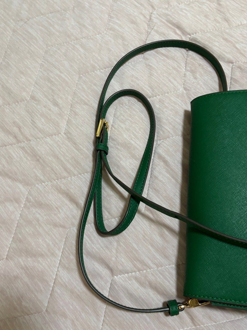 Tory Burch Green Crossbody Bag (Category: Luxury Bags & Wallets) located in Quezon City. Submitted by gtancollection (Listing ID 1410862814, Image 3). Description: Authentic Tory Burch crossbody bag Color: Emerald Stone Material: Saffiano Leather Dimension: Height: 6” ; length: 9” ; depth: 2.5” Adjustable, removable shoulder/crossbody strap with 20-22.5” drop Holds an iPhone Pro Max Rolled gold hardware Magnetic Snap closure Dust bag is NOT inclu