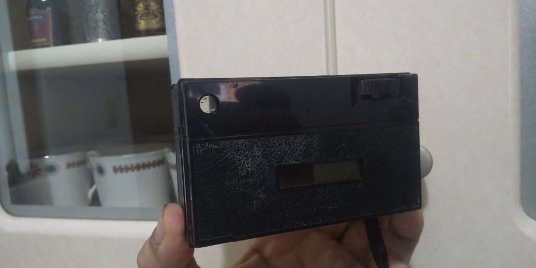 Vintage X-126 Camera (Category: Cameras) located in Carmona. Submitted by rpute (Listing ID 1410746989, Image 2). Description: Vintage X-126 camera. It has a black and beige color scheme. The camera has a lens, a viewfinder, and a flash. The camera's back can be opened..