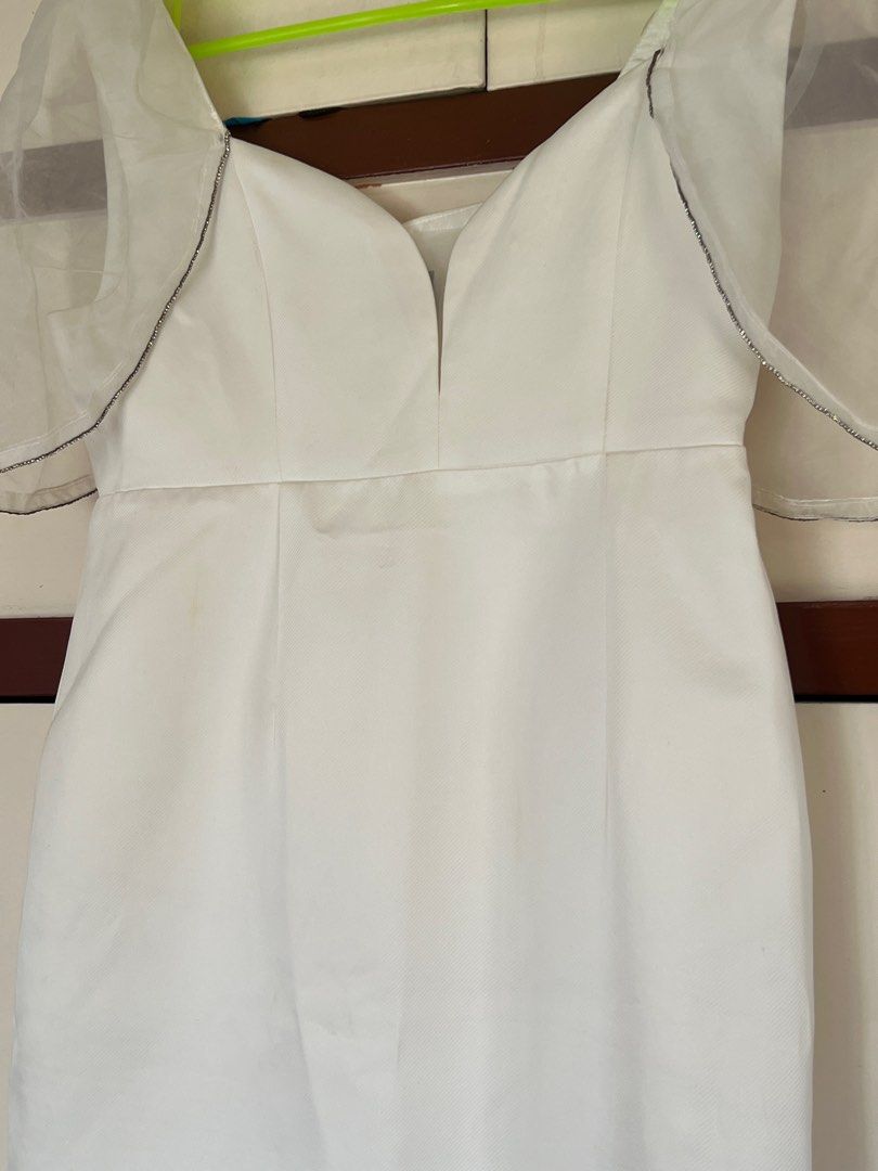 White Dress with Sheer Sleeves (Category: Dresses) located in Manila. Submitted by decluttermnlmd (Listing ID 1410729993, Image 3). Description: - White dress - Sweetheart neckline - Sheer sleeves with black trim - Fitted silhouette - Knee-length - Satin-like fabric - Ideal for special occasions This was bought in SM Mags for 3,500 pesos, used once and cleaned. May need additional cleaning for use since finit ulit pero di na kasya. For Medium to 