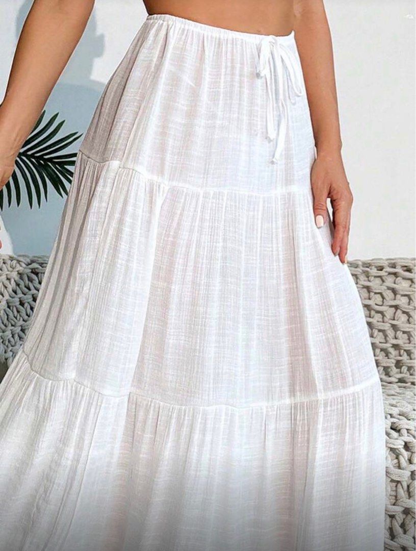White Tiered Maxi Skirt (Category: Skirts) located in Pasig City. Submitted by Arieee (Listing ID 1410767441, Image 3). Description: XS-Large (refer to the uploaded photo for the actual sizing) Used only during a Boracay trip Flaws: There is a small tear that needs to be stitched. - Elegant white maxi skirt - Tiered design with flowing silhouette - Drawstring waist for adjustable fit - Ideal for casual wear or beach cover-up - Made from lightweig