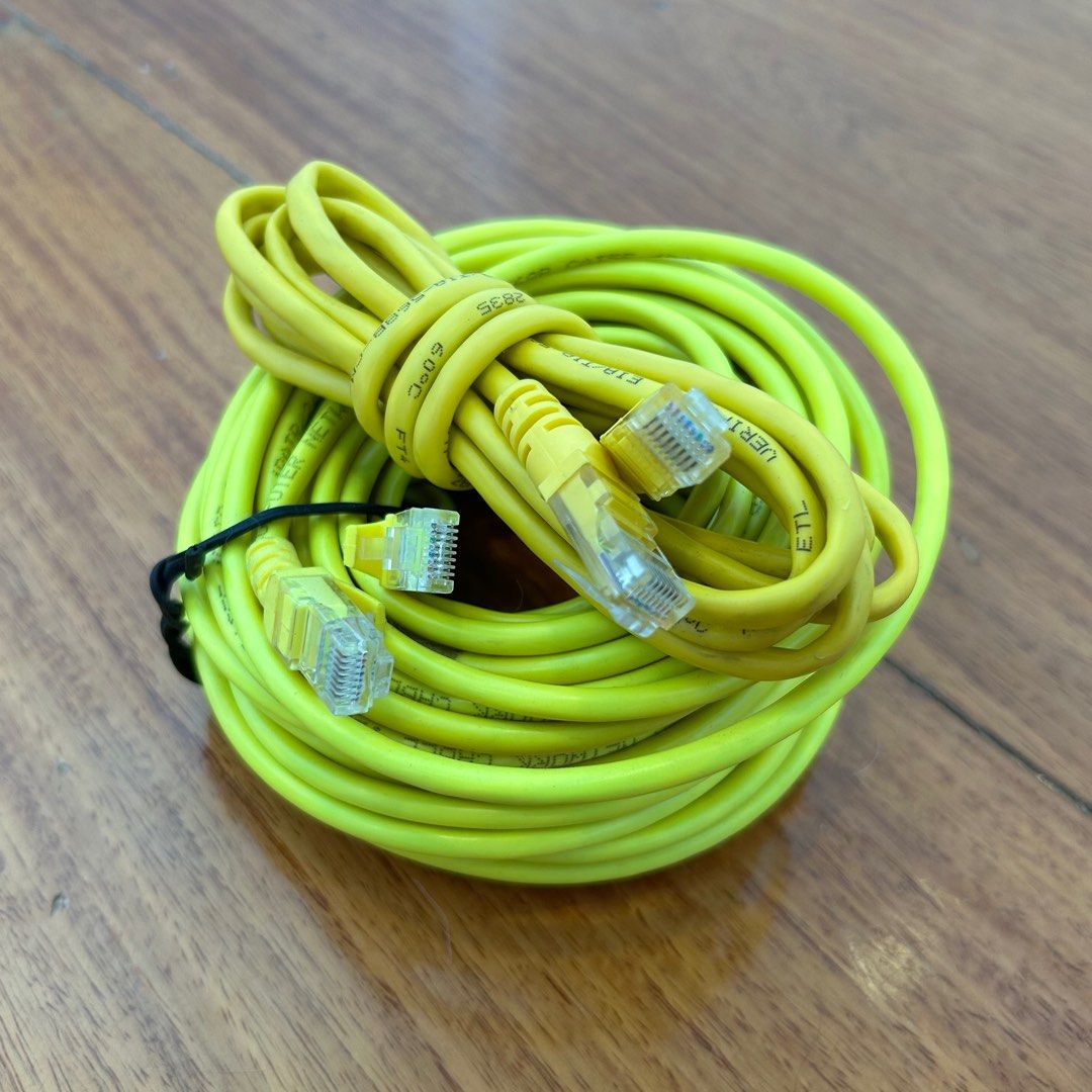 Yellow Ethernet Cables (Category: Cables & Adaptors) located in Quezon City. Submitted by nowthatslegitph (Listing ID 1410816588, Image 3). Description: Yellow Ethernet cables. Includes two cables, one coiled and one bundled. Both cables have RJ45 connectors. The longer cable is secured with a black cable tie. Perfect for connecting devices to your network..