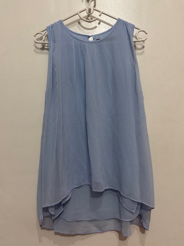 Zara Light Blue Asymmetrical Flowy Top (Category: Sleeveless) located in Mandaluyong City. Submitted by minasitems (Listing ID 1410887015, Image 2). Description: Used only a few times! Very nice top RFS: Not my style anymore Size on tag: M 📌 Dimensions (when laid flat): Width: 18 inches Length: 25 inches 📌 MOP: GCash 📌 MOD: Lalamove/Grab, J&T, GGX, LBC 📌 Location: Mandaluyong/Ortigas.