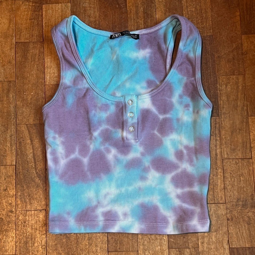 Zara Tie-Dye Tank Top (Category: Sleeveless) located in Quezon City. Submitted by dawnnya (Listing ID 1410854282, Image 2). Description: - Zara tie-dye tank top - Unique blue and purple tie-dye pattern - Ribbed texture - Scoop neck design - Features three buttons - Sleeveless - Cropped style RFS: Clearing out closet..