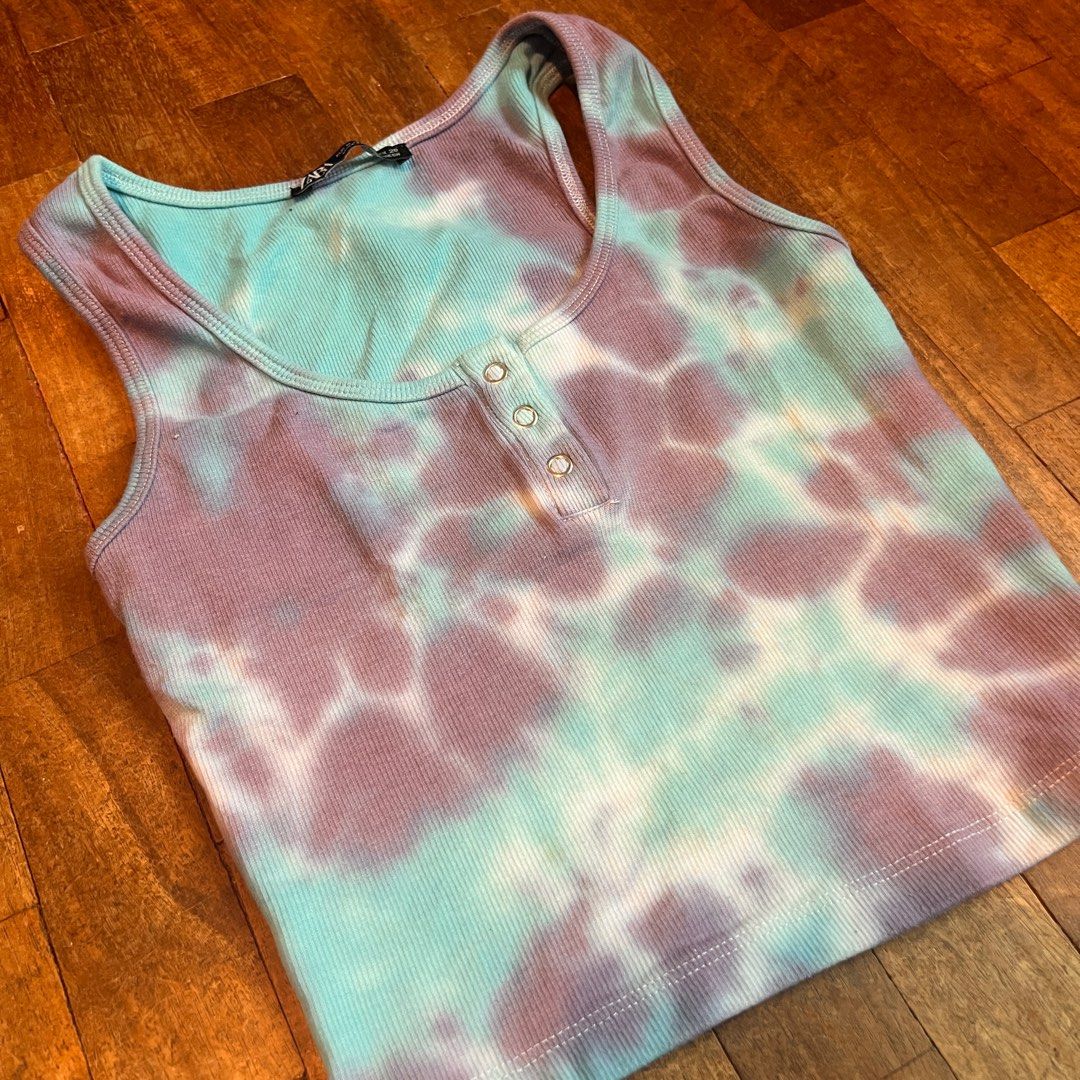 Zara Tie-Dye Tank Top (Category: Sleeveless) located in Quezon City. Submitted by dawnnya (Listing ID 1410854282, Image 1). Description: - Zara tie-dye tank top - Unique blue and purple tie-dye pattern - Ribbed texture - Scoop neck design - Features three buttons - Sleeveless - Cropped style RFS: Clearing out closet..