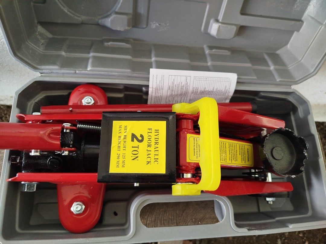 2 Ton Hydraulic Floor Jack (Category: Construction Tools & Equipment) located in Quezon City. Submitted by poortwenty (Listing ID 1410967595, Image 1). Description: Hydraulic floor jack is rated for 2 tons. It comes in a gray carrying case. The jack is red and yellow. The minimum height is 128mm and the maximum height is 280mm. It is a trolley floor jack. Always use a jack stand for support of the lifted load. Never use the hydraulic jack as the 
