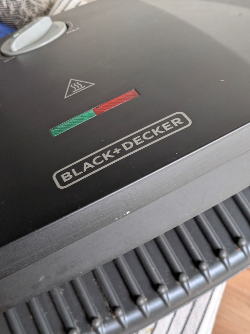 Black+Decker Sandwich Maker (Category: Other Kitchen Appliances) located in Mandaluyong City. Submitted by k-guico7 (Listing ID 1410947259, Image 2). Description: Black+Decker sandwich maker with adjustable temperature control. Features indicator lights for power and ready status. The appliance has a non-stick surface for easy cleaning. It is designed for making sandwiches quickly and efficiently. The unit is compact and suitable for home use. Pi