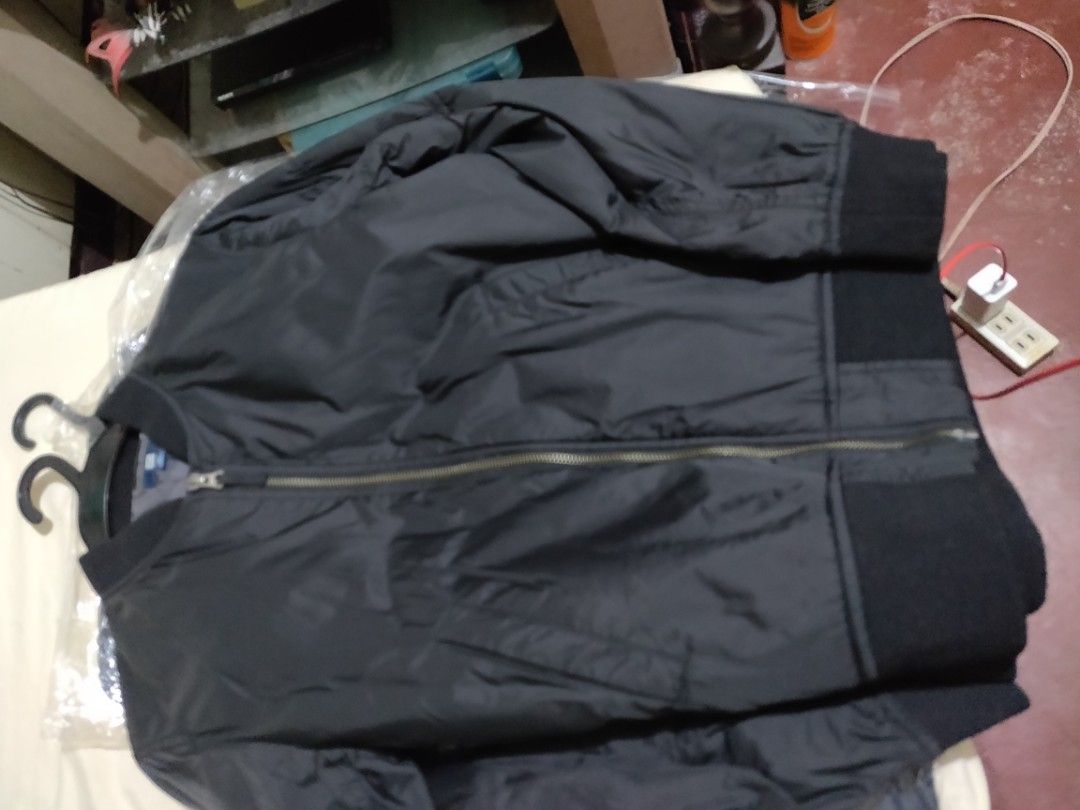 Bomber Jacket - Black (Category: Coats, Jackets and Outerwear) located in Valenzuela. Submitted by jaypee.jaypee (Listing ID 1410901326, Image 3). Description: - Classic bomber jacket design - Available in olive green and black - Ribbed collar, cuffs, and hem - Zip-up front - Two front pockets - Smooth, possibly nylon-like material - Ideal for casual wear - Kids boys.