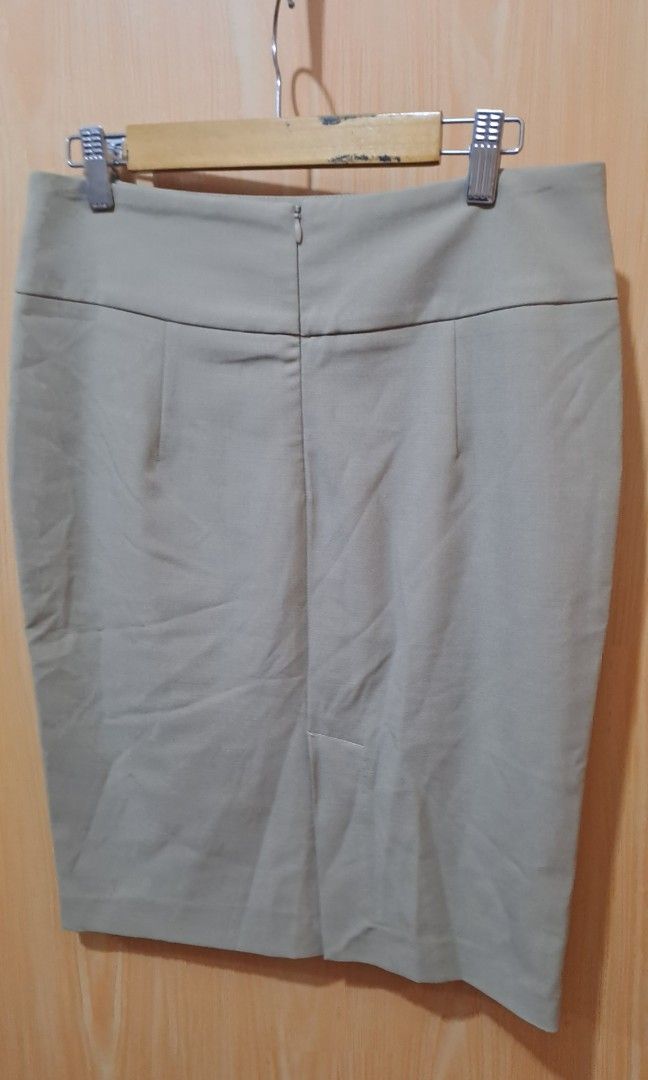 Calypso Beige pencil cut Skirt (Category: Skirts) located in Las Pinas. Submitted by beng2024 (Listing ID 1408569011, Image 2). Description: - Calypso beige pencit cut skirt - waist Size 28 but can fit up to 30 - hips up to 39" -length 22" - Zipper closure at the back with slit - Simple design - Suitable for various occasions - Made of smooth, likely woven fabric, no inner lining.