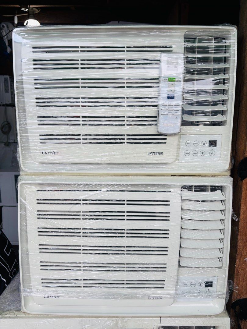 Carrier full inverter Air Conditioner (Category: Air Conditioning and Heating) located in Manila. Submitted by gentlelion_c472b1 (Listing ID 1410902007, Image 2). Description: - Carrier Inverter air conditioner - Includes remote control - Digital display - Control buttons for fan, mode, timer, and swing - White color.