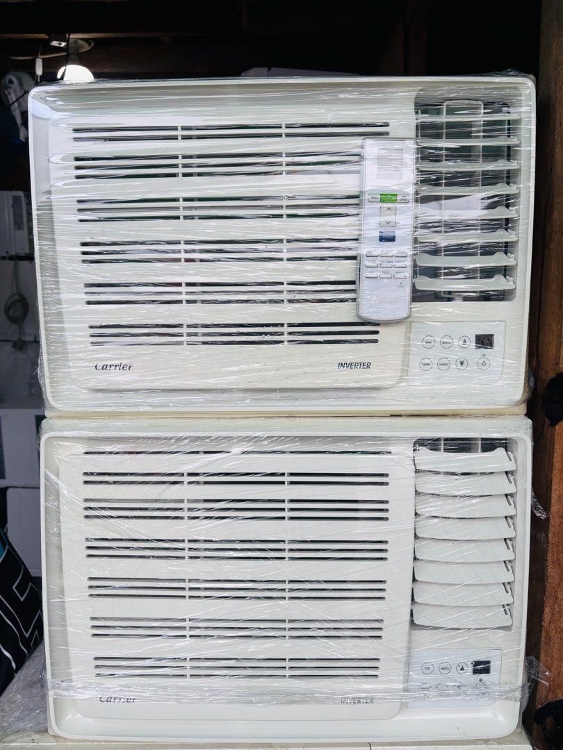 Carrier full inverter Air Conditioner (Category: Air Conditioning and Heating) located in Manila. Submitted by gentlelion_c472b1 (Listing ID 1410902007, Image 3). Description: - Carrier Inverter air conditioner - Includes remote control - Digital display - Control buttons for fan, mode, timer, and swing - White color.