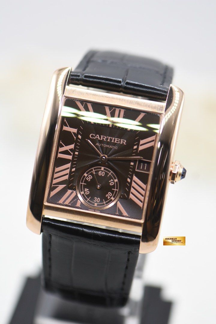 CARTIER TANK MC LARGE MEN’S ROSE GOLD IN LEATHER STRAP AUTOMATIC W5330002 (MINT) (Category: Watches) located in Singapore. Submitted by goldmanluxury (Listing ID 1411011588, Image 2). Description: Item No : GML4386 DESCRIPTION : Cartier Tank MC Large Men’s Rose Gold in Leather Strap Automatic. Ref: W5330002. No: 3590 DIAL : Brown Guilloche dial, Printed Roman Numerals and Blue hands. Sapphire Crystal. CASE : 34mm X 44mm Rose Gold case – original 