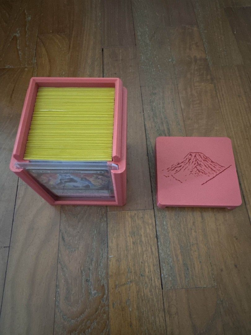 Custom TCG Deck Box Service (MTG, Riftbound, Pokemon, One Piece, Gundam, etc..) (Category: Trading Cards Accessories) located in Singapore. Submitted by hyperionxter (Listing ID 1410734645, Image 7). Description: [ Status ] Open 🌞 (last updated 1 April 2026) Card Deck Box making services. Able to mix and match colors. Able to fit 100 double sleeved cards! Dimensions(LxWxH): 8.7cm x 8.2cm x 12cm Feel free to enquire. Check our listing for custom 