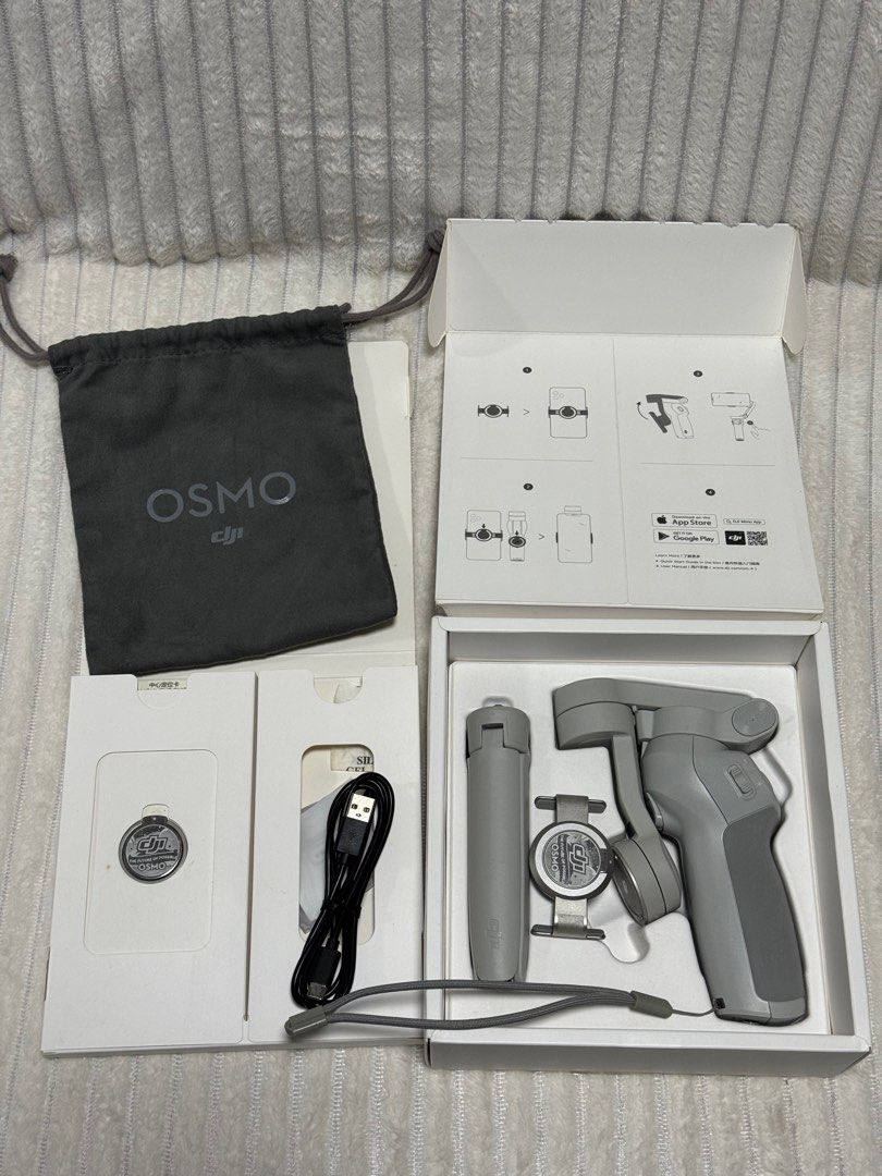 DJI OM 4 (Osmo Mobile 4) Smartphone Gimbal Stabilizer (Category: Gimbals & Stabilizers ) located in Dasmarinas. Submitted by behindthehype_sg (Listing ID 1411073805, Image 2). Description: The DJI OM 4 (Osmo Mobile 4) is a foldable, 3-axis smartphone gimbal stabilizer that uses a new magnetic quick-release system to quickly attach and balance your phone, making it easier to capture ultra-smooth, professional-looking videos and photos. It’s design