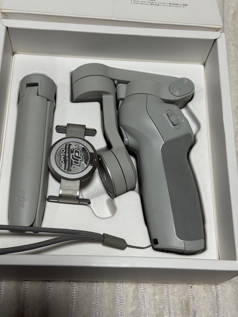 DJI OM 4 (Osmo Mobile 4) Smartphone Gimbal Stabilizer (Category: Gimbals & Stabilizers ) located in Dasmarinas. Submitted by behindthehype_sg (Listing ID 1411073805, Image 3). Description: The DJI OM 4 (Osmo Mobile 4) is a foldable, 3-axis smartphone gimbal stabilizer that uses a new magnetic quick-release system to quickly attach and balance your phone, making it easier to capture ultra-smooth, professional-looking videos and photos. It’s design